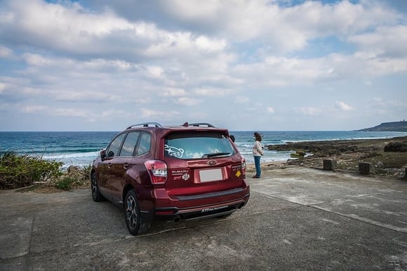 Red car near the coast