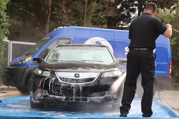 Spiffy technician car wash and detail for black Acura sedan Spiffy technician car wash and detail for black Acura sedan