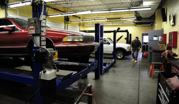 Car in the shop getting tires rotated Car in the shop getting tires rotated