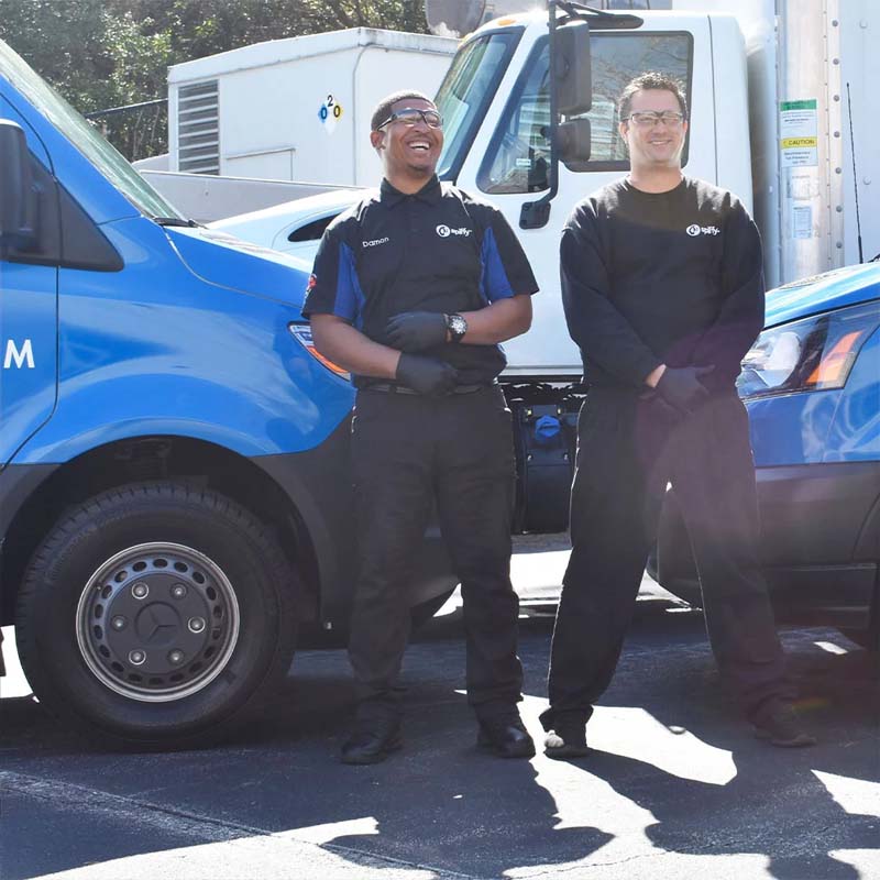 Spiffy Techs laughing at a job site